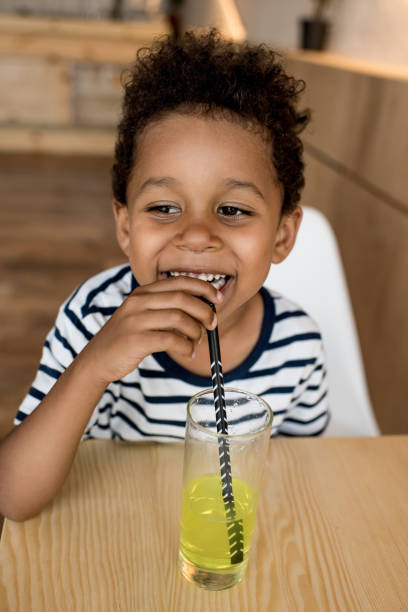 istock african american child drinking juice 861383304