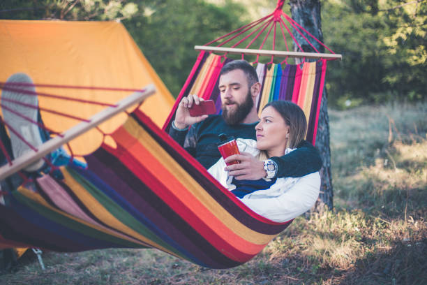 istock Romantic hipster couple enjoy rest on a hammock 861386856