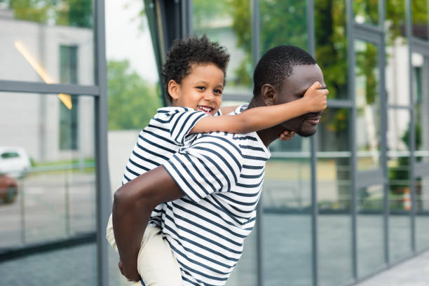 istock african american father piggybacking son 861387108