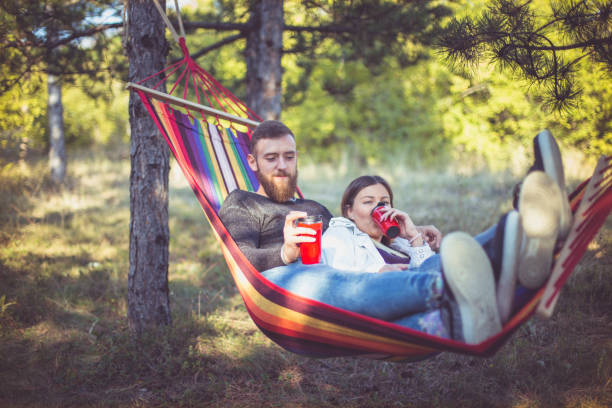 istock Beautiful happy couple relaxing in a hammock 861387328