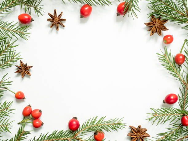 istock Christmas decorations on a white background, berries rose hips, stars, fir branches. copy space 861392080