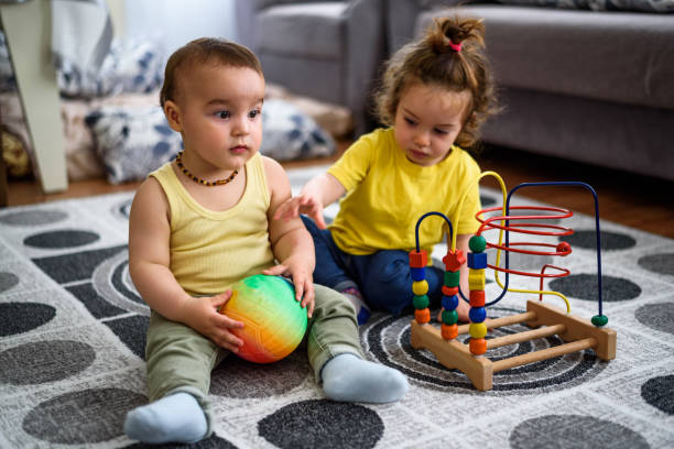 istock Cute babies playing with toys 861395294