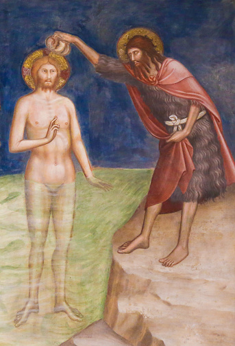 Renaissance Fresco depicting the Baptism of Jesus Christ by Saint John the Baptist in the Collegiata of San Gimignano, Italy.