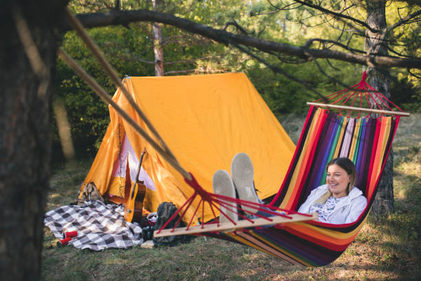 istock Young woman relaxing in a hammock 861405168
