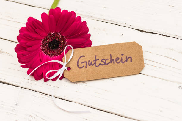 istock Beautiful daisy gerbera flower gift with voucher tag 861405198