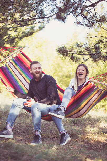 istock Beautiful happy couple relaxing in a hammock 861405308