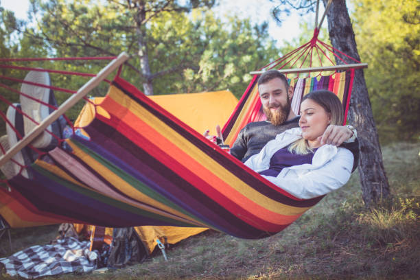 istock Romantic hipster couple enjoy rest on a hammock 861408008