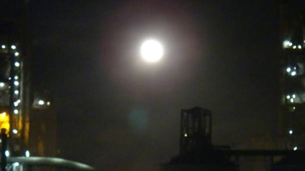istock A luminous moon in an industrial area 861408056