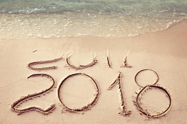 istock New Year 2018 replace 2017 on sea beach summer, New Year 2017 is coming concept. Closeup 861408148