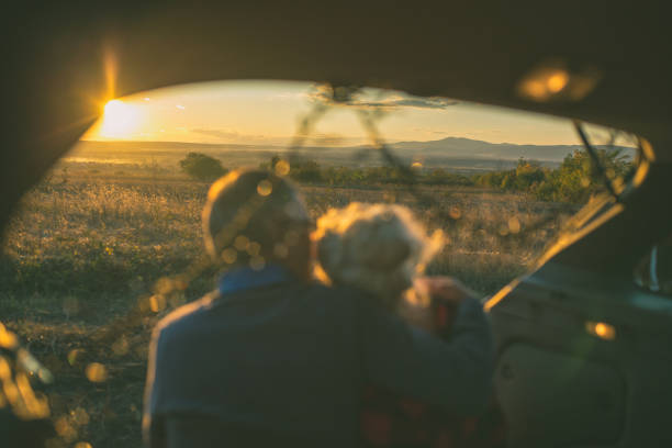 istock Senior couple outdoors with car 861408420