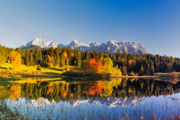 Indian Summer at Tennsee, Karwendel Mountains, Bavarian Alps, XXL Panorama Tennsee, Karwendel Mountains, Autumn, Reflection, Werdenfels, Mittenwald, Bavaria allgau stock pictures, royalty-free photos & images