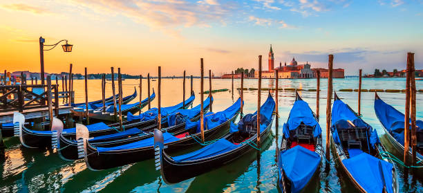 istock Venice with famous gondolas at sunrise 861409780