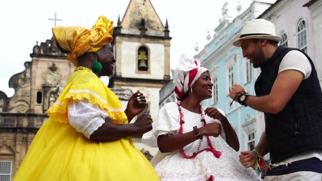 Tourist Dancing and Throw his hat for Native Woman Brazilian People - 