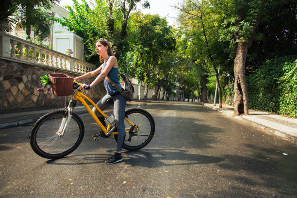 istock Young attractive woman riding a bicycle. 861412634