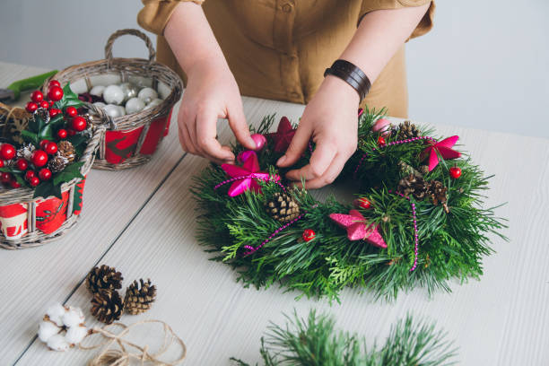istock Florist decorator making Christmas wreath 861412992