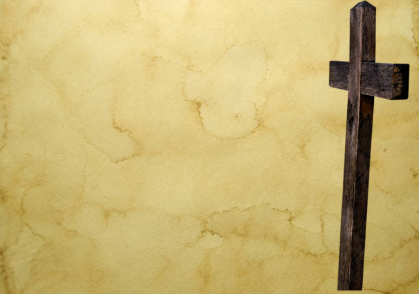 istock Wood crucifix silhouette  on parchment with copy space 861415288