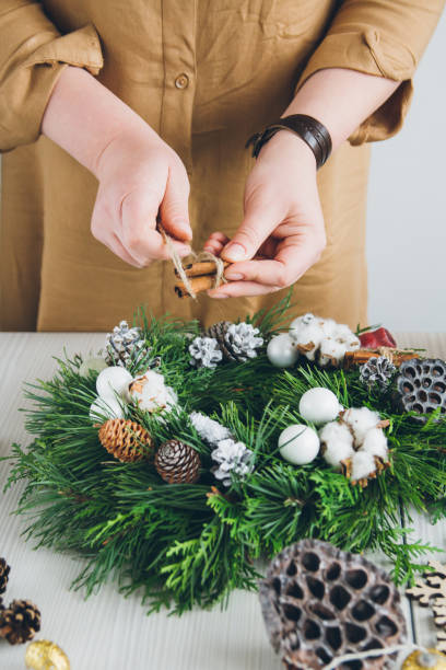 istock Florist decorator making Christmas wreath 861418742