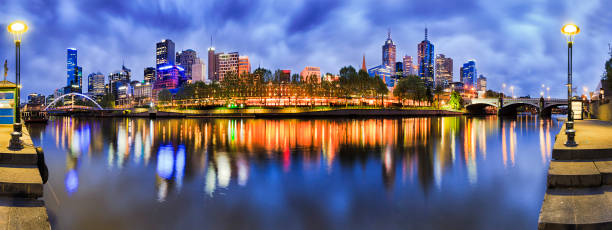 Me Yarra CBD Blue rise pan 180 degrees panorama of Melbourne city CBD from South Yarra with reflection of bright morning city lights in still river waters. south yarra stock pictures, royalty-free photos & images