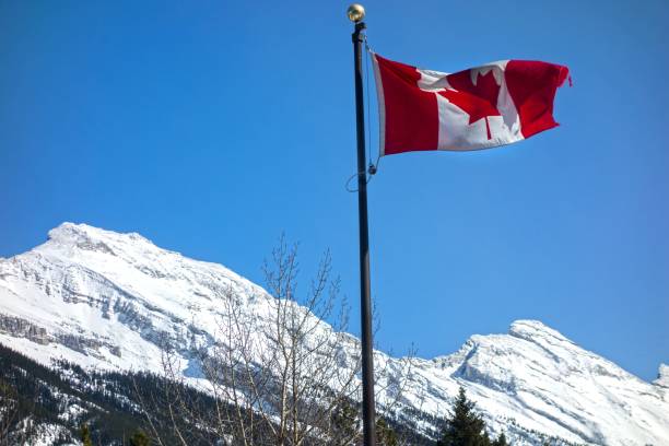 istock Canadian National Flag and Rocky Mountains 861427074