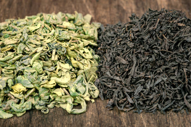 istock Green and black tea leaves 861427372