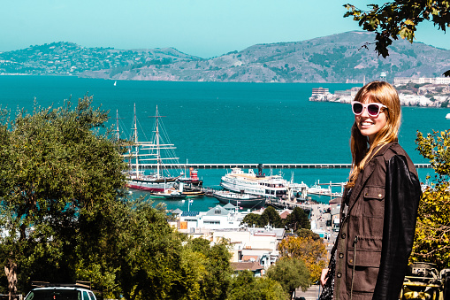 Photo of Girl near ocean and mountains in San Francisco, California