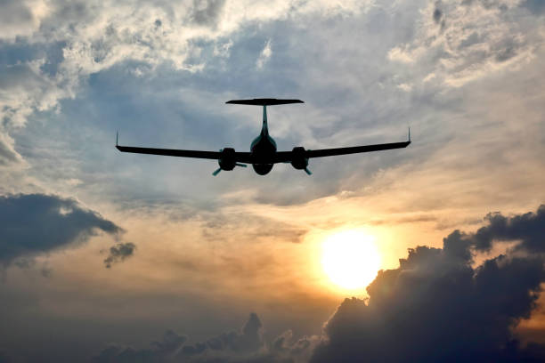 istock light aircraft flying in the sky at sunset 861456174