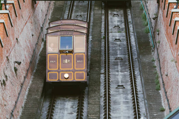 Vintage cable car in Budapest, Hungary. The Budapest Vintage cable car was built in 1870. During the Second World War, it was severely damaged, and in the next five years all the remaining details were pulled apart. The funicular was restored and began to function again only in 1986.