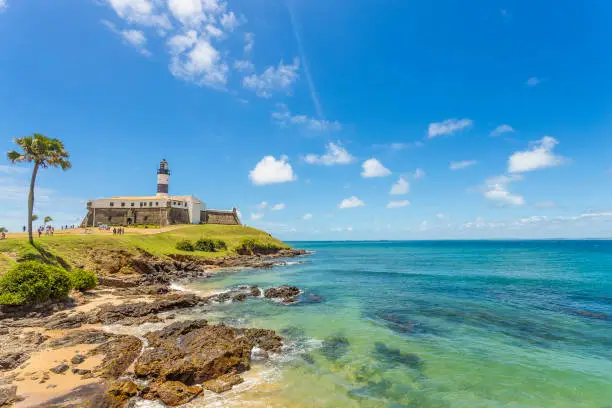 A wide picture of the Barra's Lighthouse in Bahia, Brazil, taken in a bright and beautiful day. Colorful and satured taken with a Canon 6D.