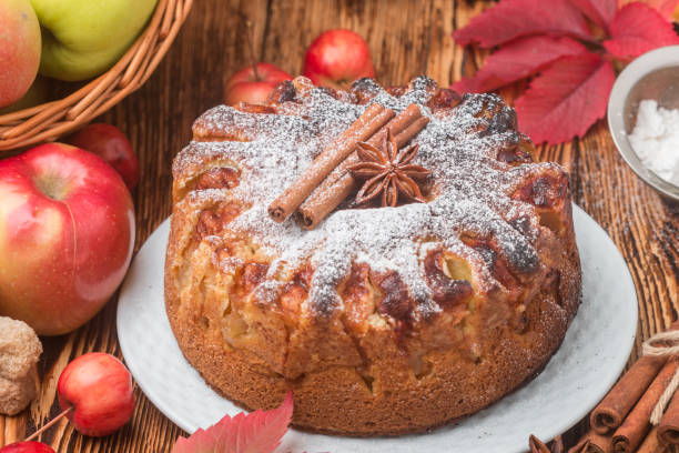 istock Apple pie with cinnamon, cardamom, anise, powdered sugar. Homemade delicious cakes for tea. Rustic style, selective focus 861457272
