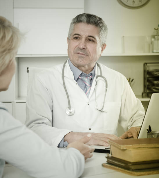 istock Professor of medicine training colleague 861464866