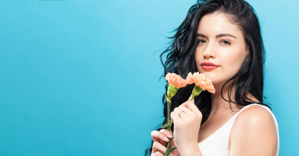 istock Young woman with carnation 861467476