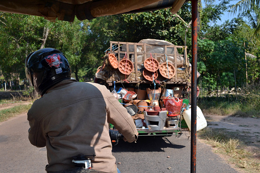 A tricycle driver carrying some tourists around Angkor Wat and Siem Reap. Pic was taken in January 2015.