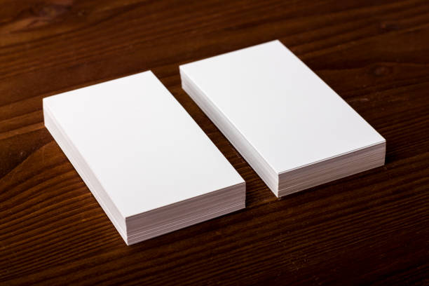 istock Blank business cards on wooden background 861489720