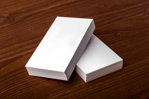 istock Blank business cards on wooden background 861489740