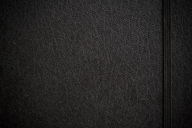 black leather notebook Close up vintage of black leather notebook texture background use for your texts display old black leather photo album stock pictures, royalty-free photos & images