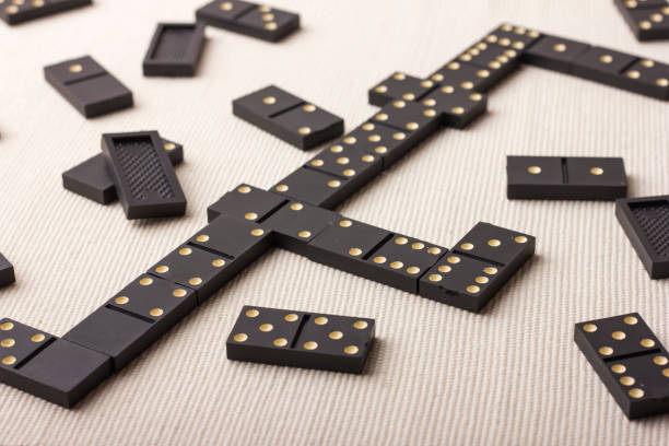 istock Dominoes are black. Light background 861492962