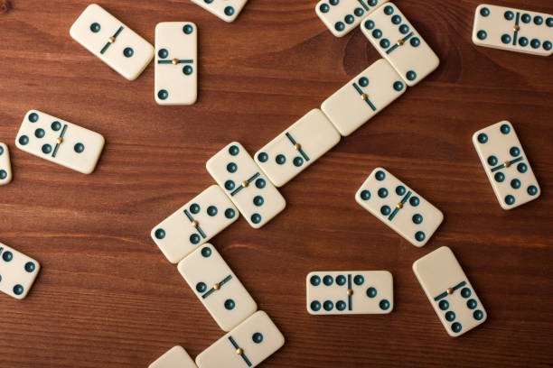 istock Dominoes on a wooden table. The game is tabletop 861493030
