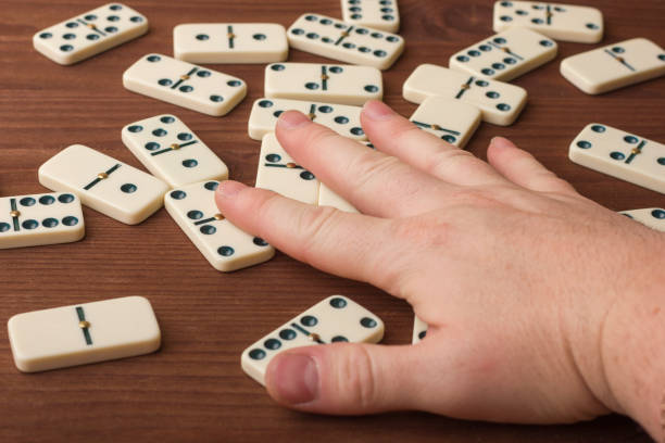 istock Dominoes on a wooden table. The game is tabletop 861493110
