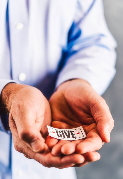 istock Male hands holding sign reading give 861493118