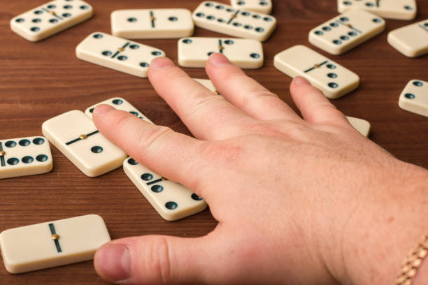 istock Dominoes on a wooden table. The game is tabletop 861493132