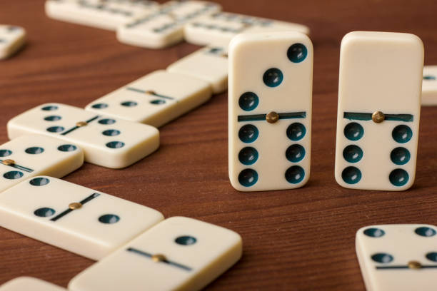 istock Dominoes on a wooden table. The game is tabletop 861493134