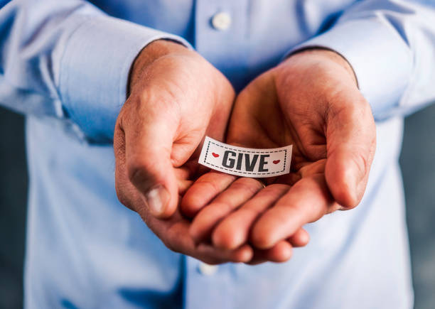istock Male hands holding sign reading give 861493422