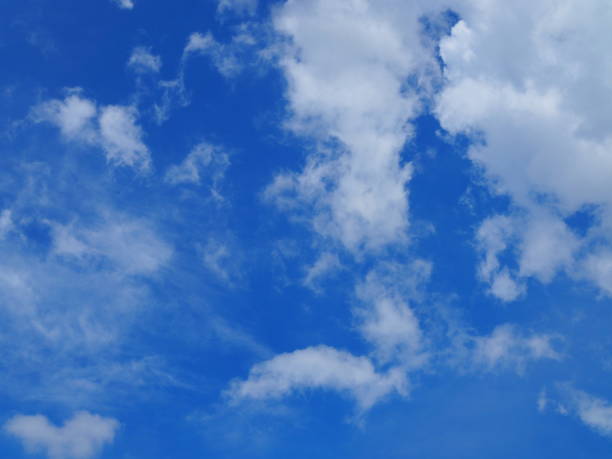 istock Dark blue sky, with spread small and big white clouds 861502506