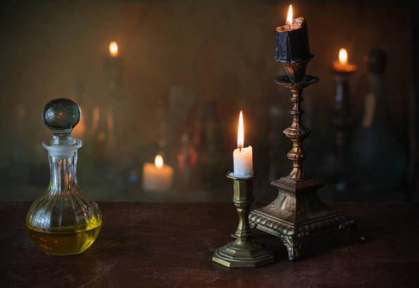 istock Magic potion, ancient books and candles on dark background 861505088