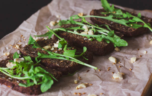 istock Vegetarian sandwiches on grain bread, nuts and arugula 861511304