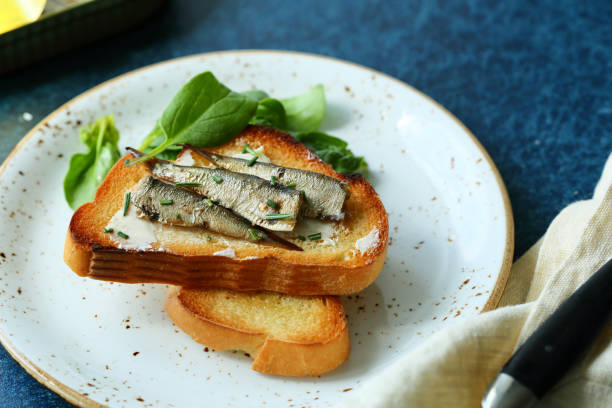 istock Sandwich with smoked sprats, food closeup 861511778