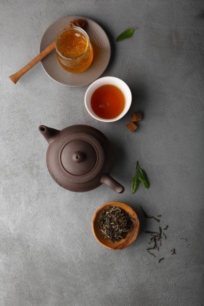 istock Tea and honey on concrete background, food above 861512062