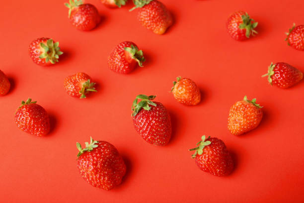 istock Strawberries on red, food closeup 861513964