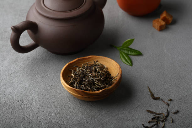 istock Green tea leaves, food closeup 861514462