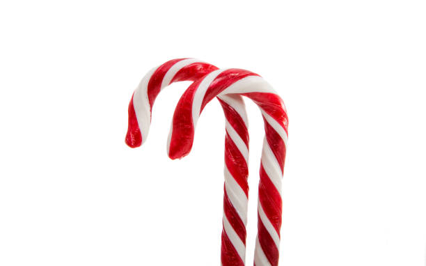 istock Christmas decoration. Traditional holiday candy cane isolated on white. 861514688